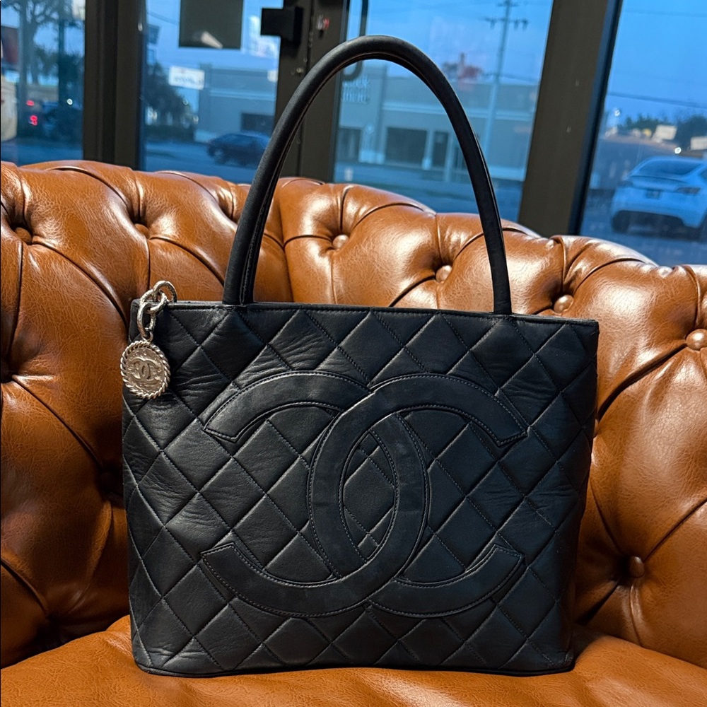 CHANEL Black Quilted Leather Shoulder Tote with CC Motif and Silver Medallion
